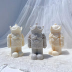 Three nutcracker figures showing crowns and rounded boots