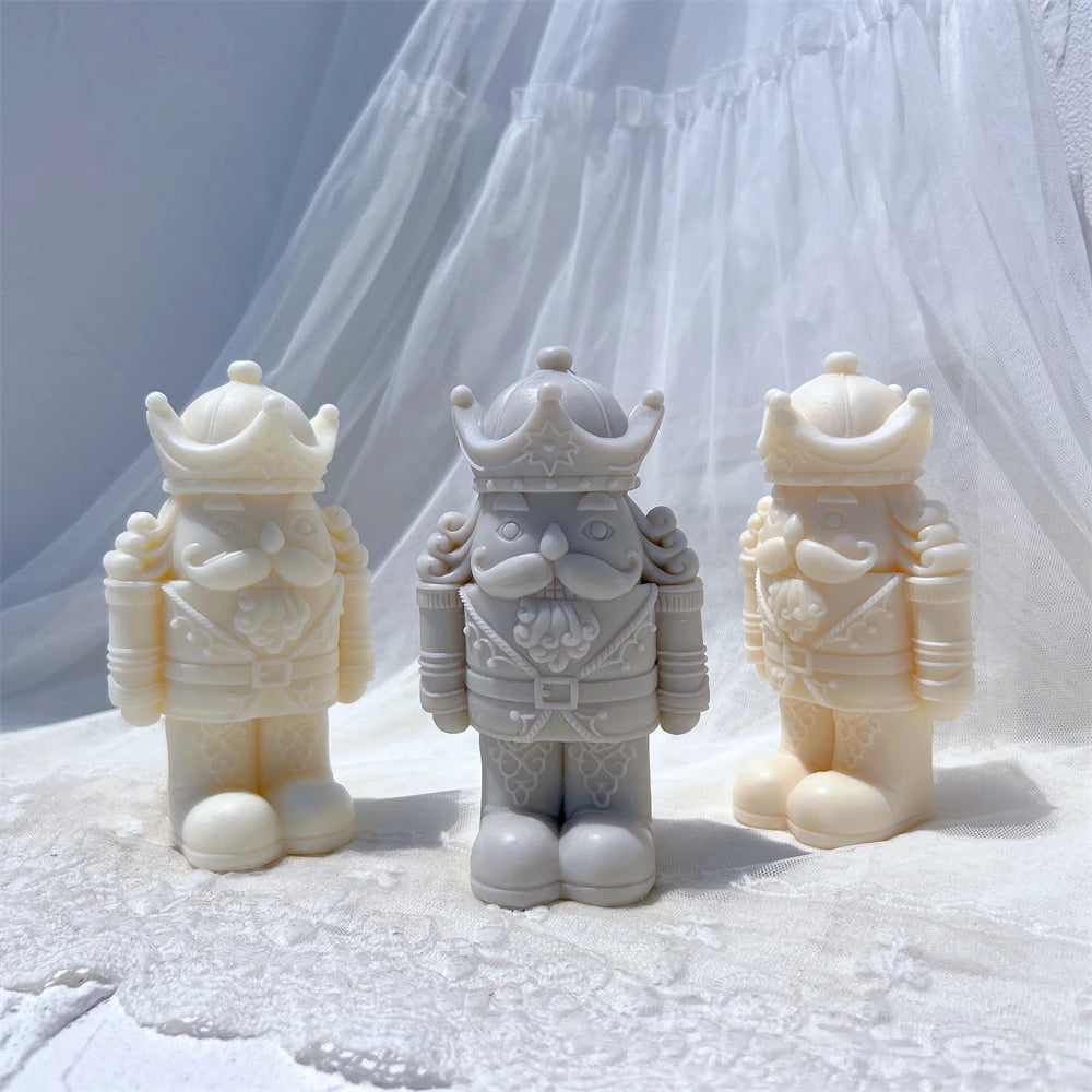Three nutcracker figures showing crowns and rounded boots