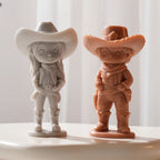 Cream cowgirl and terracotta cowboy castings in western hats and boots
