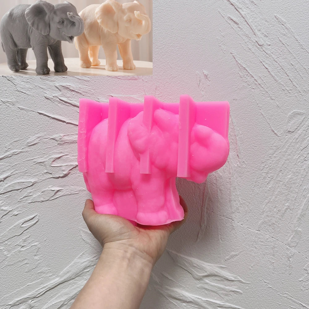Pink silicone mold for elephant with raised trunk and broad ears