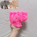 Pink silicone mold for elephant with raised trunk and broad ears