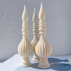 Three ribbed finial castings with fluted bulbs, ringed necks and pointed tips