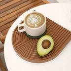 Brown arch tray casting with a cup and avocado props
