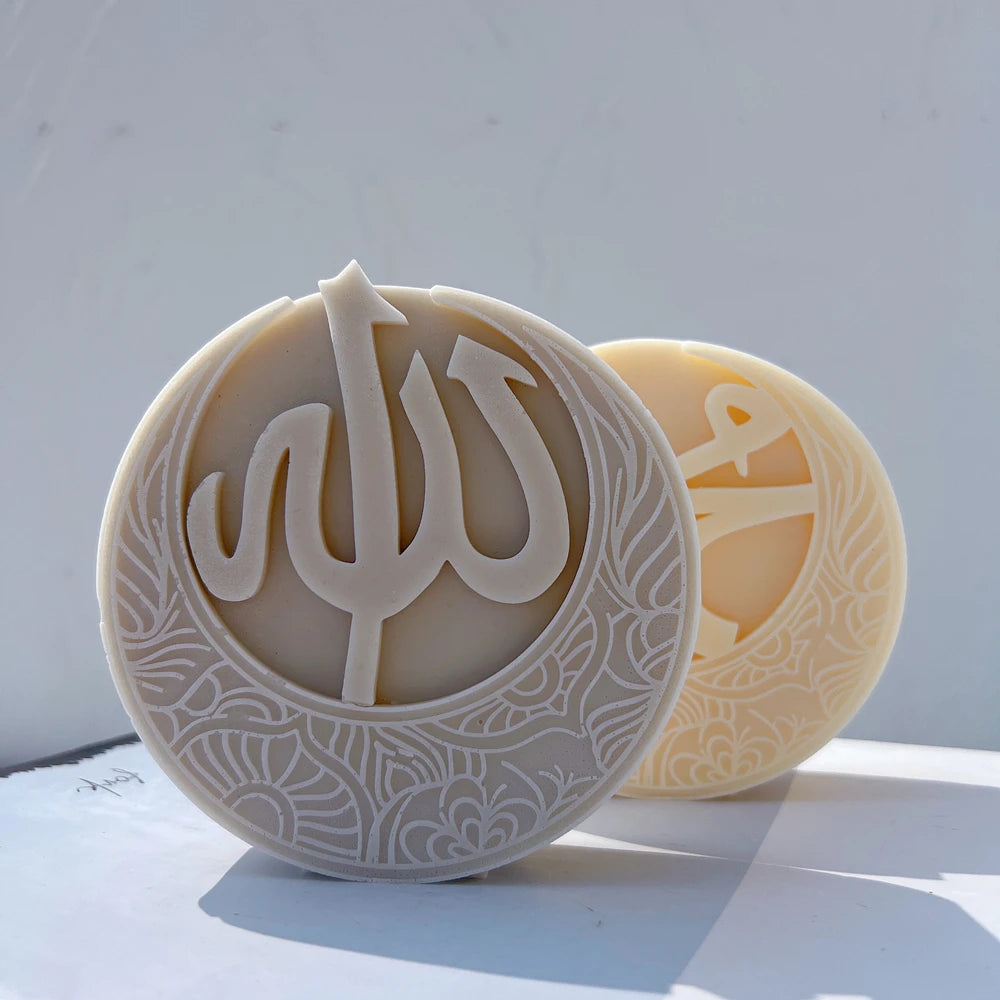 Allah crescent relief beside a Muhammad design