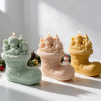 Green peach and yellow Tree Boot candle castings arranged together