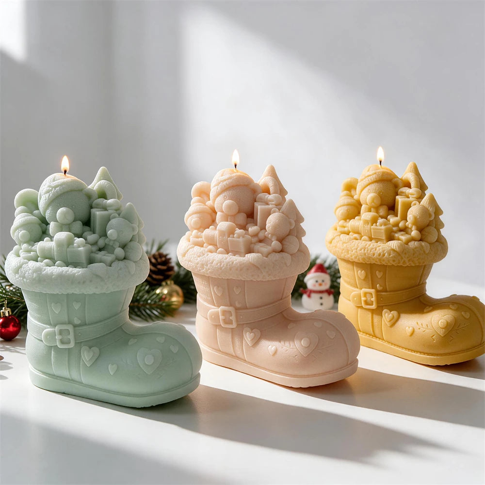 Green peach and yellow Tree Boot candle castings arranged together