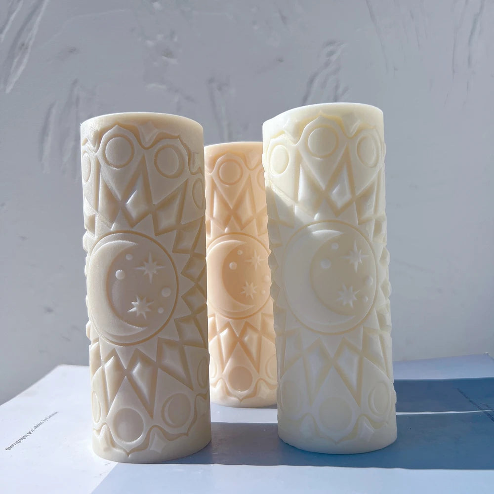 Staggered pillar candles showing the circular crescent moon relief