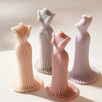 Four fitted gown castings showing detailed bodices and long pleats