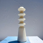 Single cream turned-spindle pillar casting with smooth surfaces