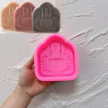 Pink silicone arch mold with Kaaba and skyline relief cavity