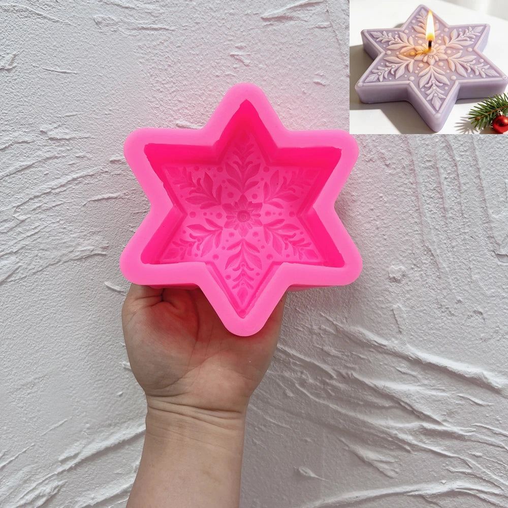 Pink silicone mold with six-point star outline and floral snowflake cavity
