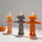 Scarecrow candle samples showing tied waists and textured cuffs