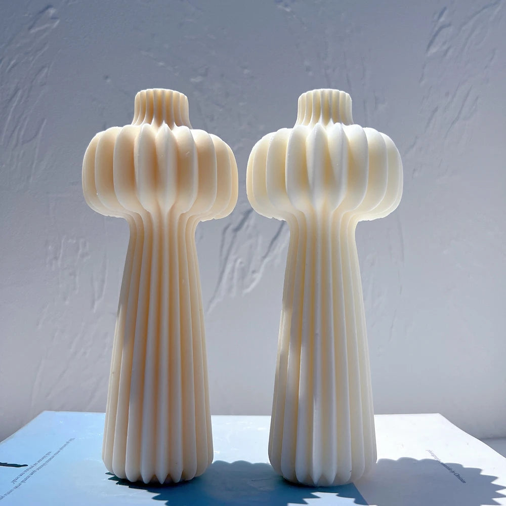 Two tall top-bulb castings with long fluted stems