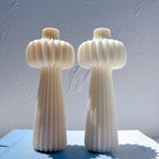 Two tall top-bulb castings with long fluted stems