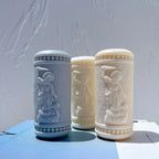 Three devotional-style pillar castings viewed from an angle