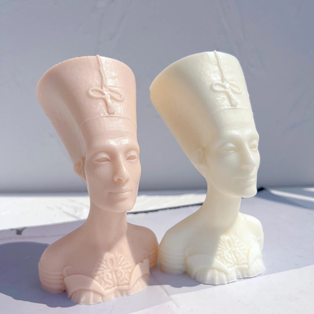 Two crowned bust castings with decorated necklines