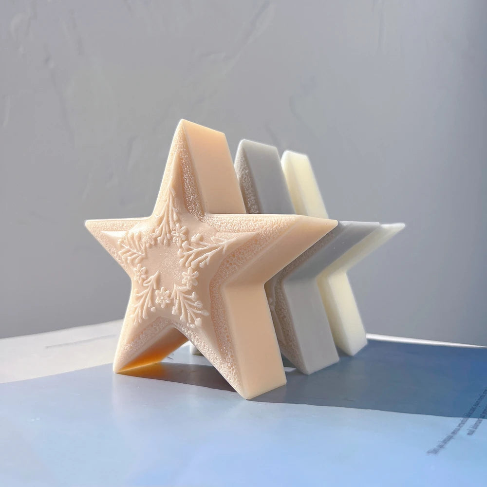 Angled peach star candle showing its thick side profile