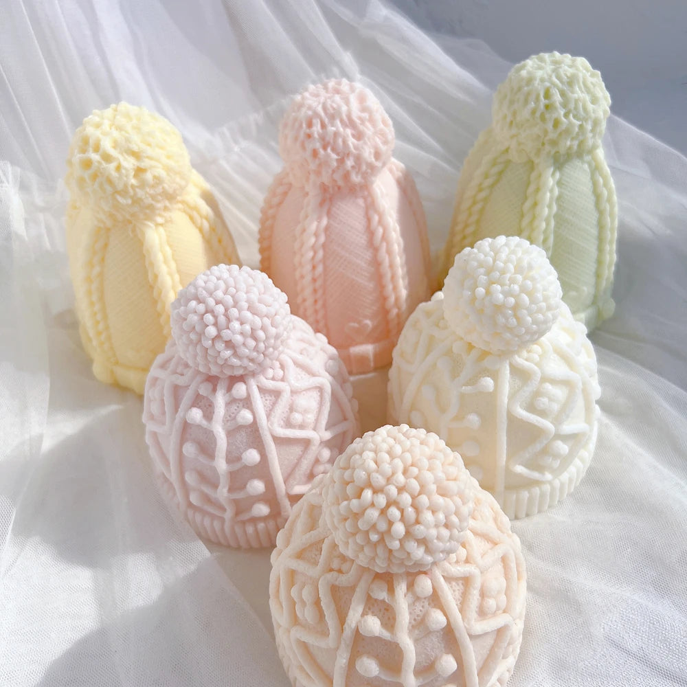 Raised geometric lines and pom-pom texture on winter hat candle samples