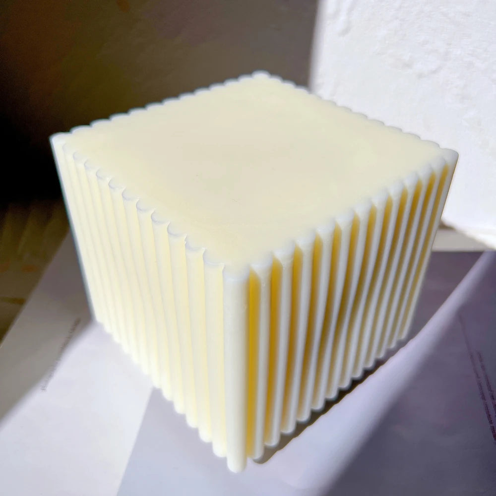 Smooth top and ribbed sides of a square candle