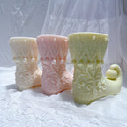 Three elf boot castings with patterned cuffs
