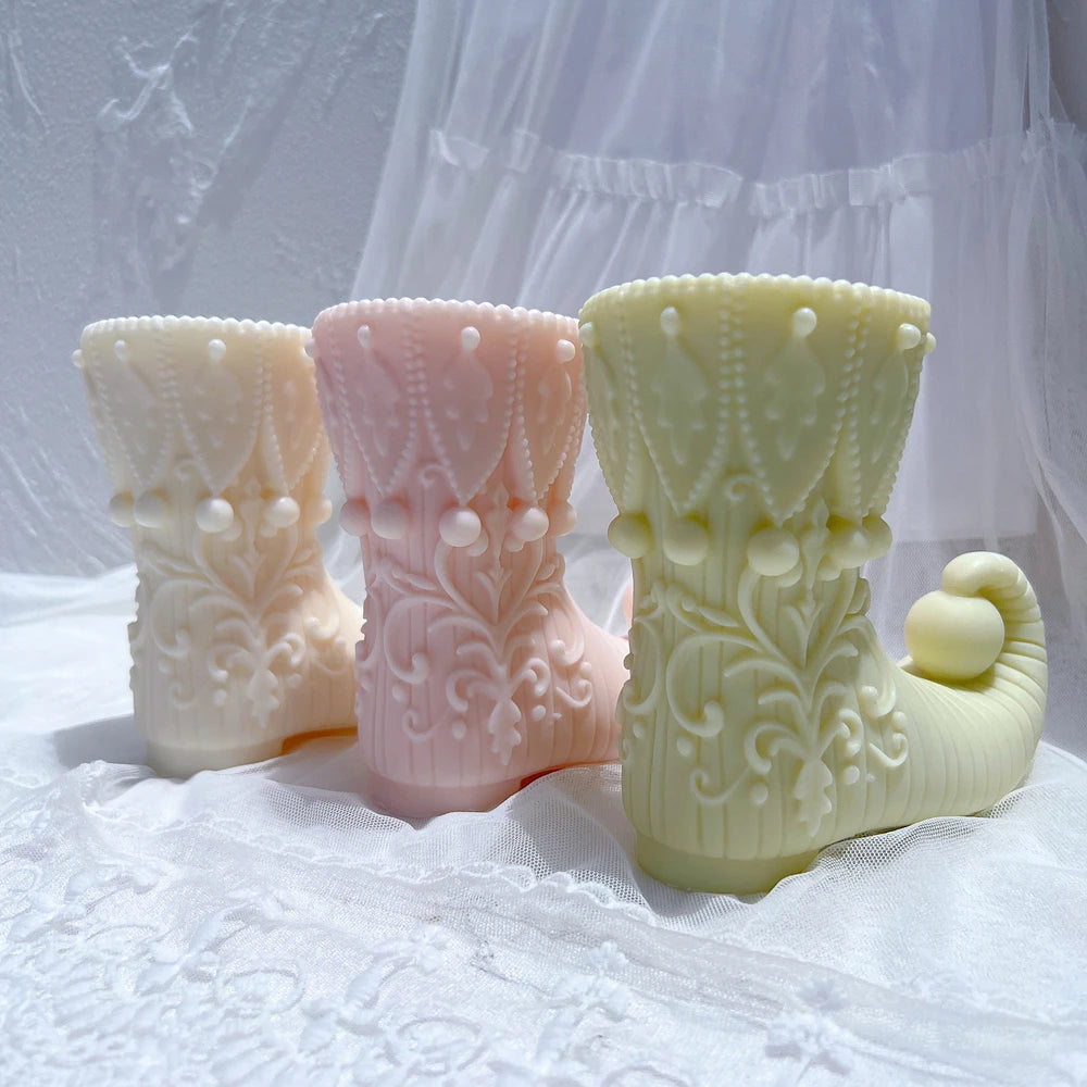 Three elf boot castings with patterned cuffs