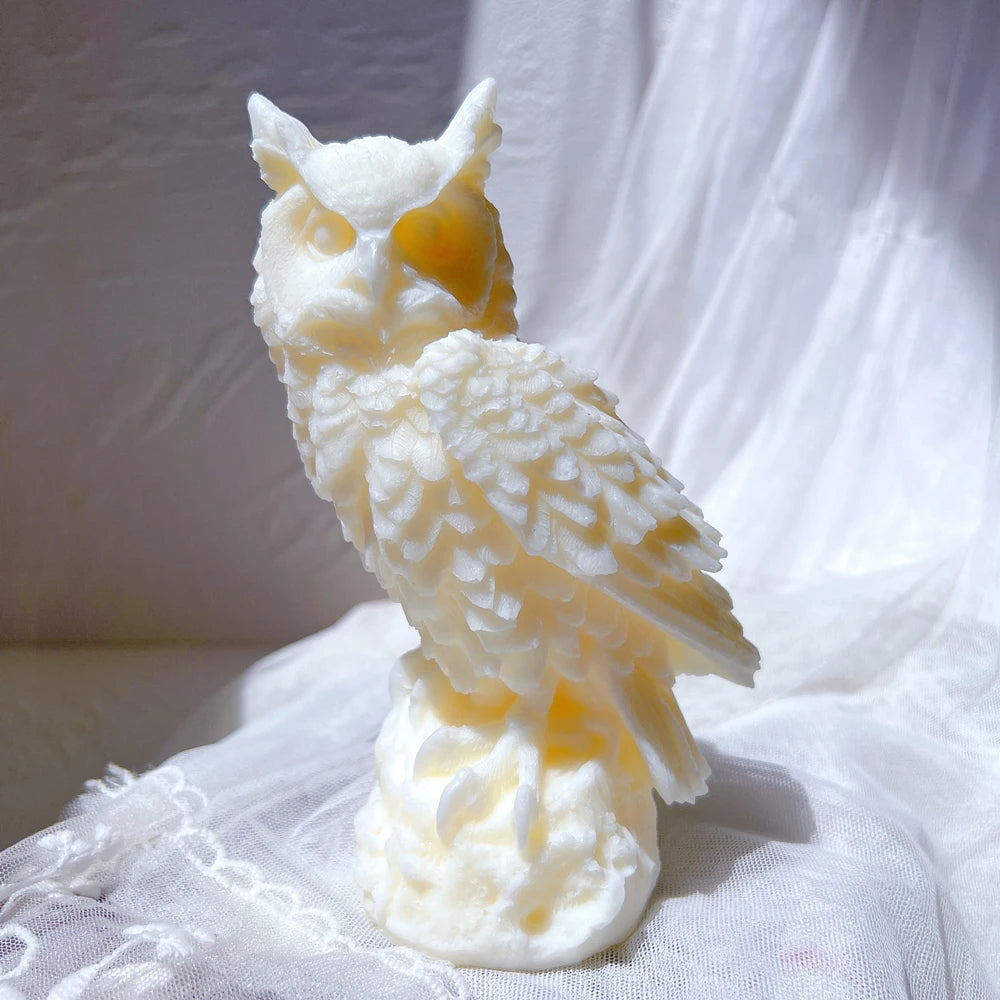 Cream owl casting with feathered chest and sculpted perch