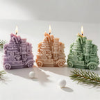 Nutcracker and Christmas tree train castings beside holiday props