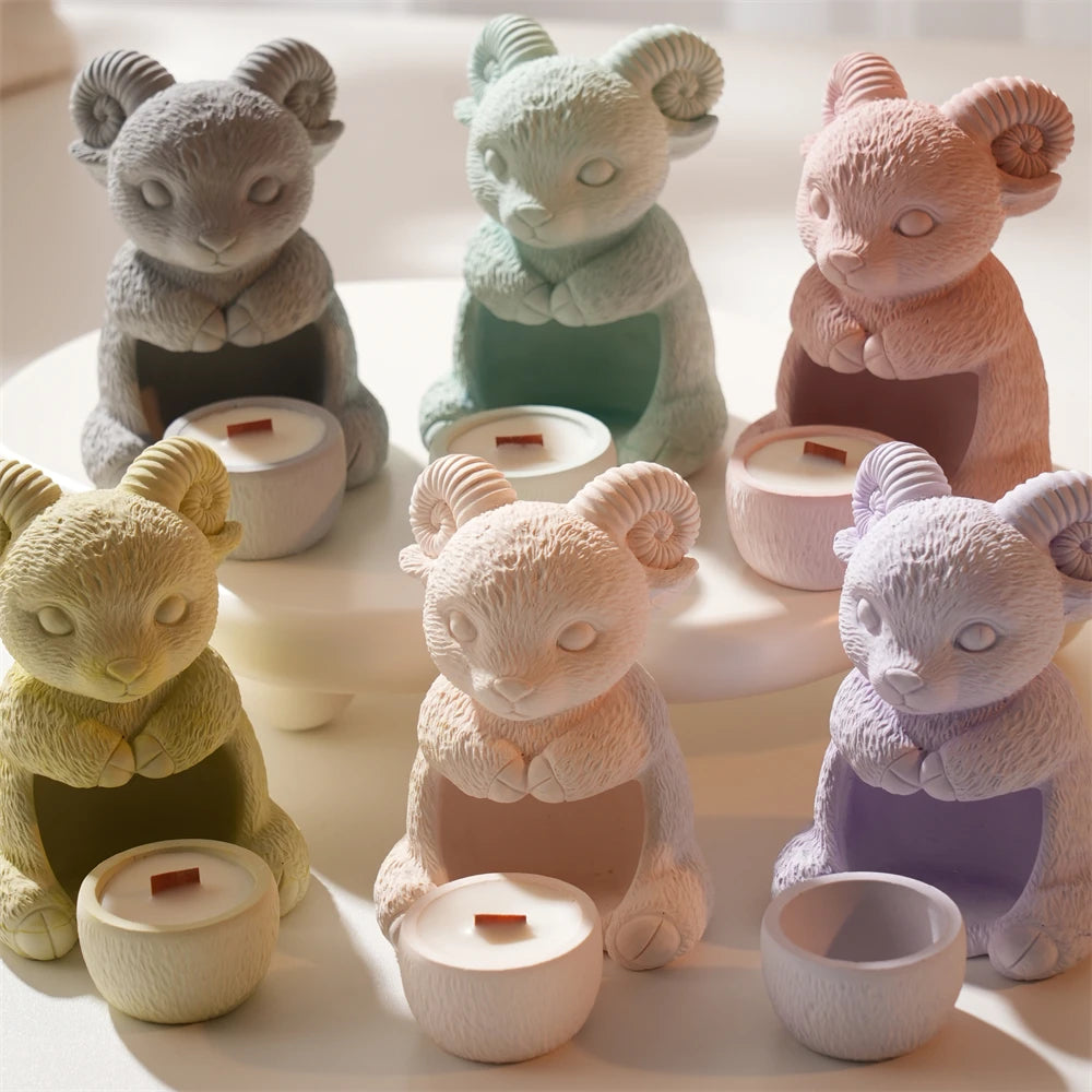Six colored ram holder samples with small candles and sculpted curled horns