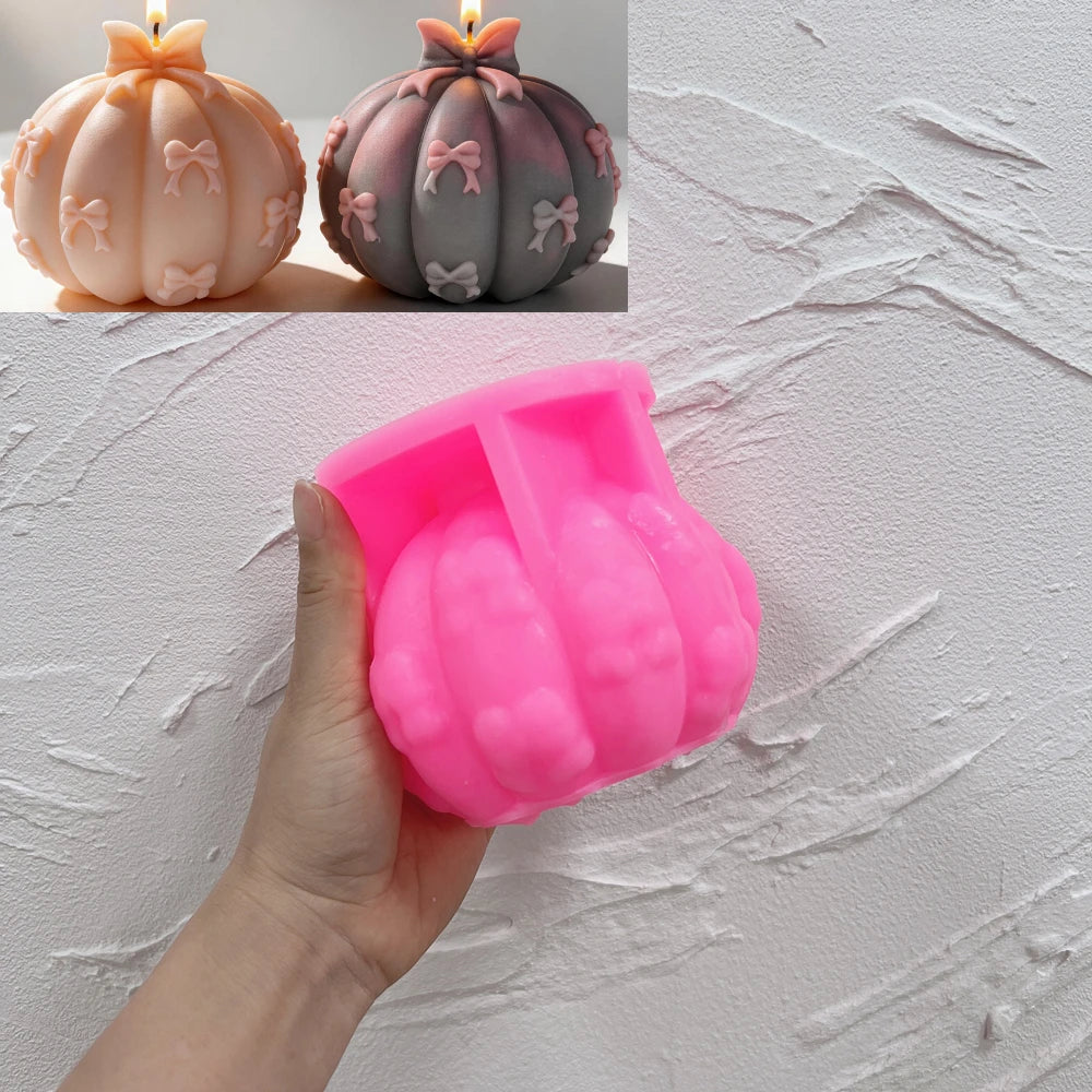 Pink silicone pumpkin mold with bow details in its cavity