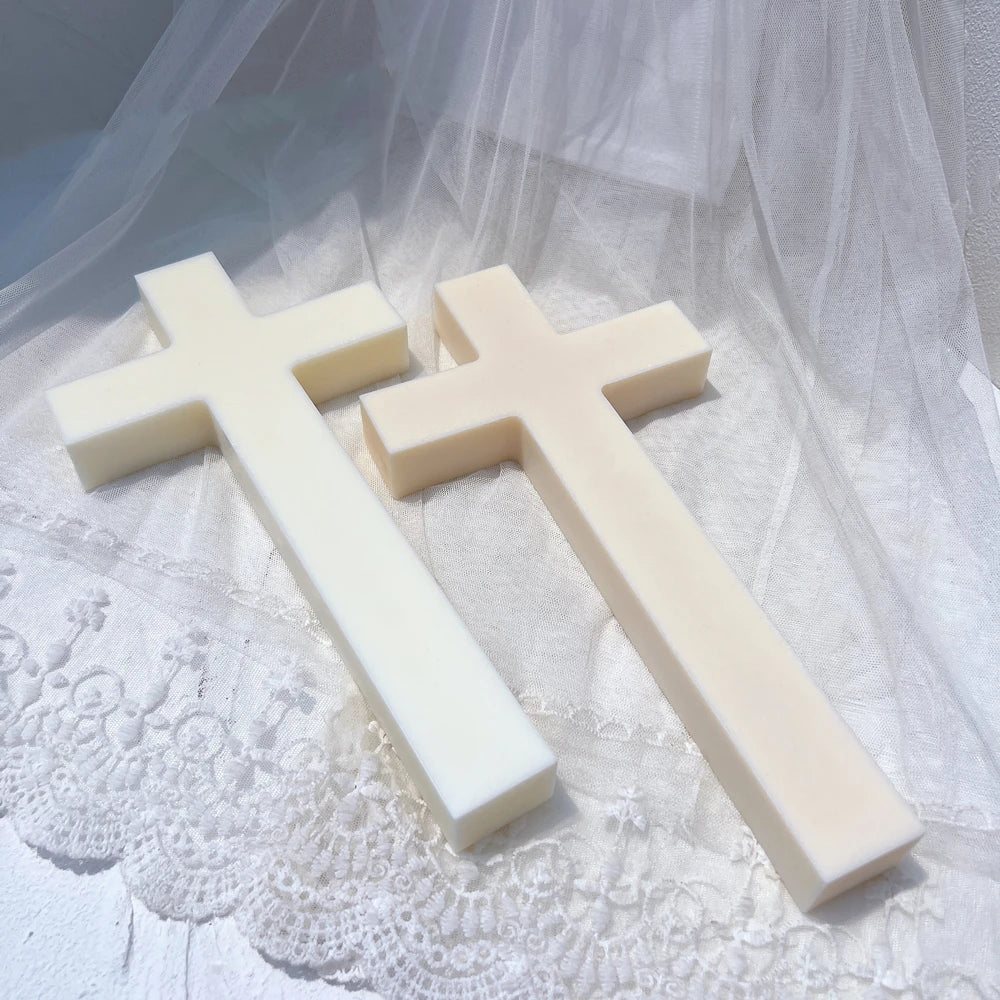 Angled view of white cross figures with straight stems and arms