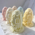 Side view of egg cottages with arched windows and trailing trim