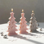 Decorative Christmas tree candles in pink and gray wax shades