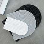 Ribbed arch tray castings standing together