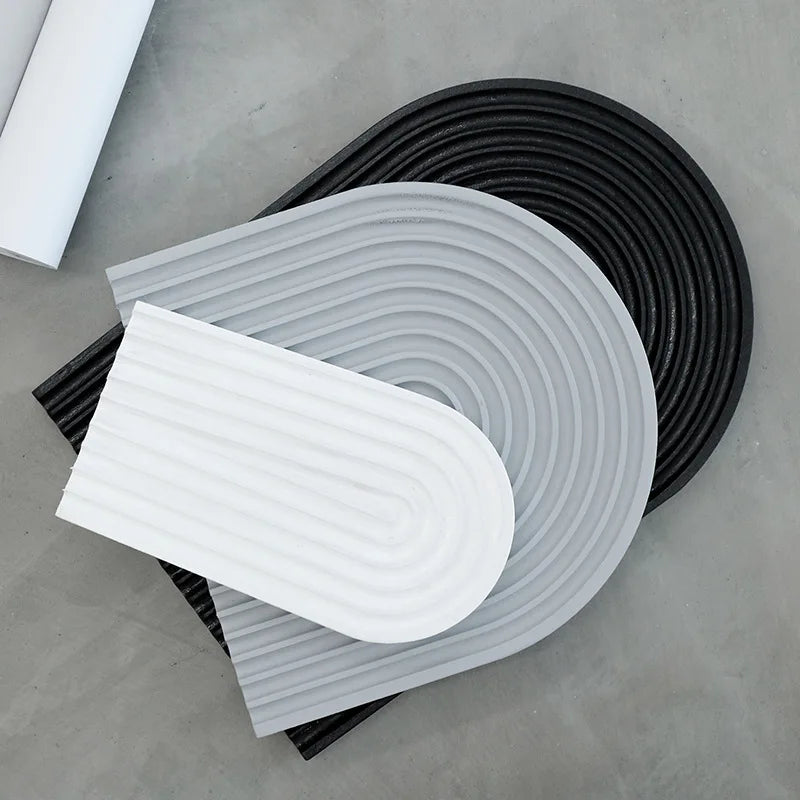 Ribbed arch tray castings standing together