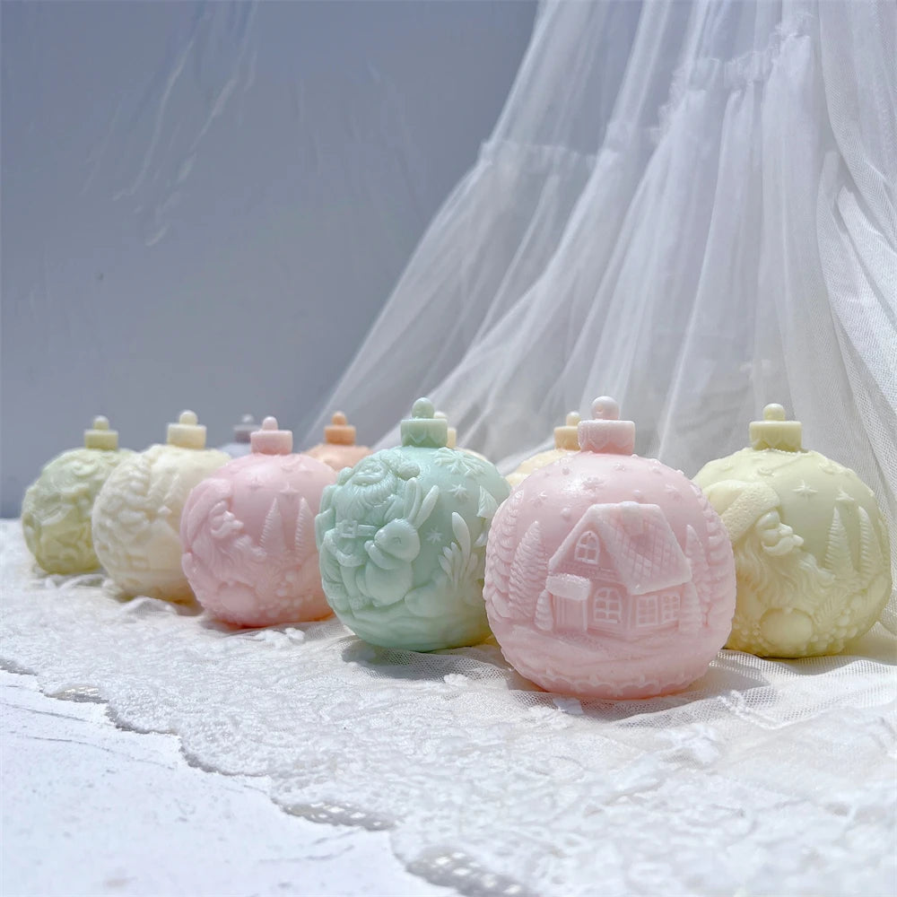Front row of cottage and Santa bauble castings