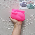 Pink silicone resting rabbit vessel mold held in a hand