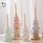 Stacked bow candleholder samples supporting slim spiral candles