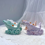 Sleigh vessels showing decorative scrollwork and runners