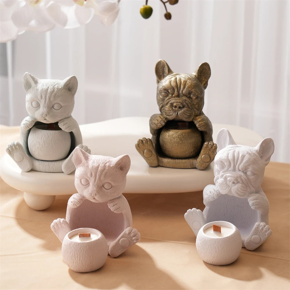 Cat holder castings with open bellies and small rounded cups