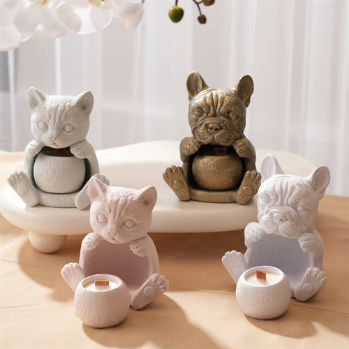 Cat holder castings with open bellies and small rounded cups