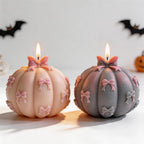 Pink and dark pumpkin candles with raised bow details