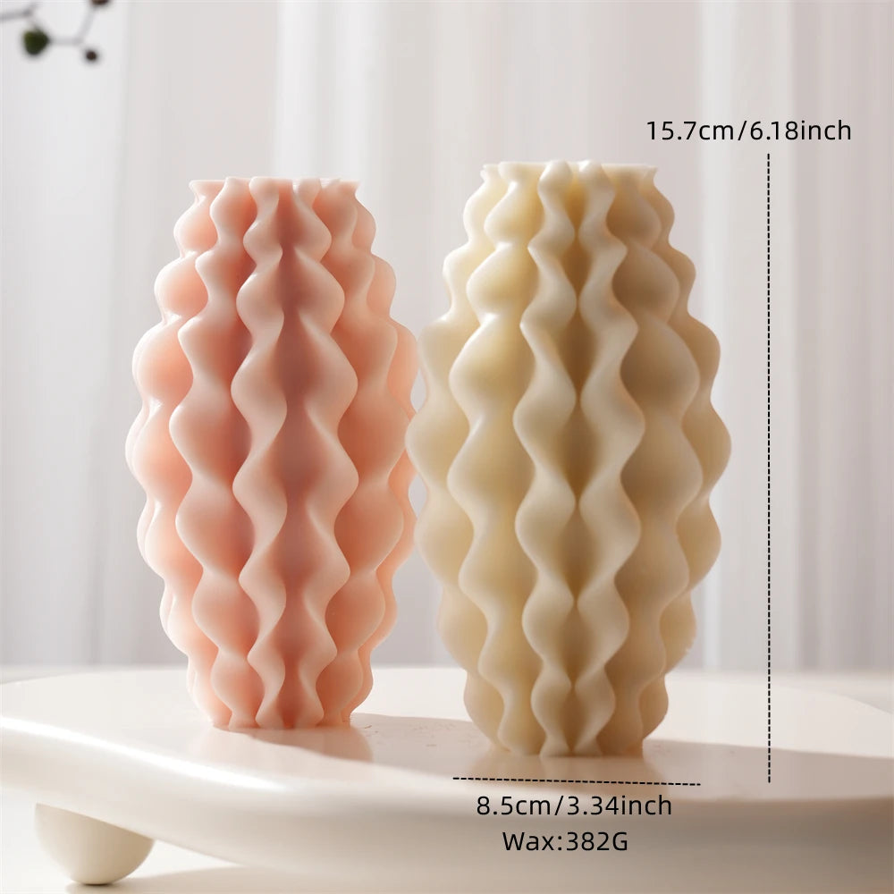Wavy pillar size-reference graphic with tall candle examples