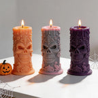 Three skull relief candle castings with Halloween props