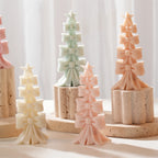 Pastel bow-stack trees with stars at their tops