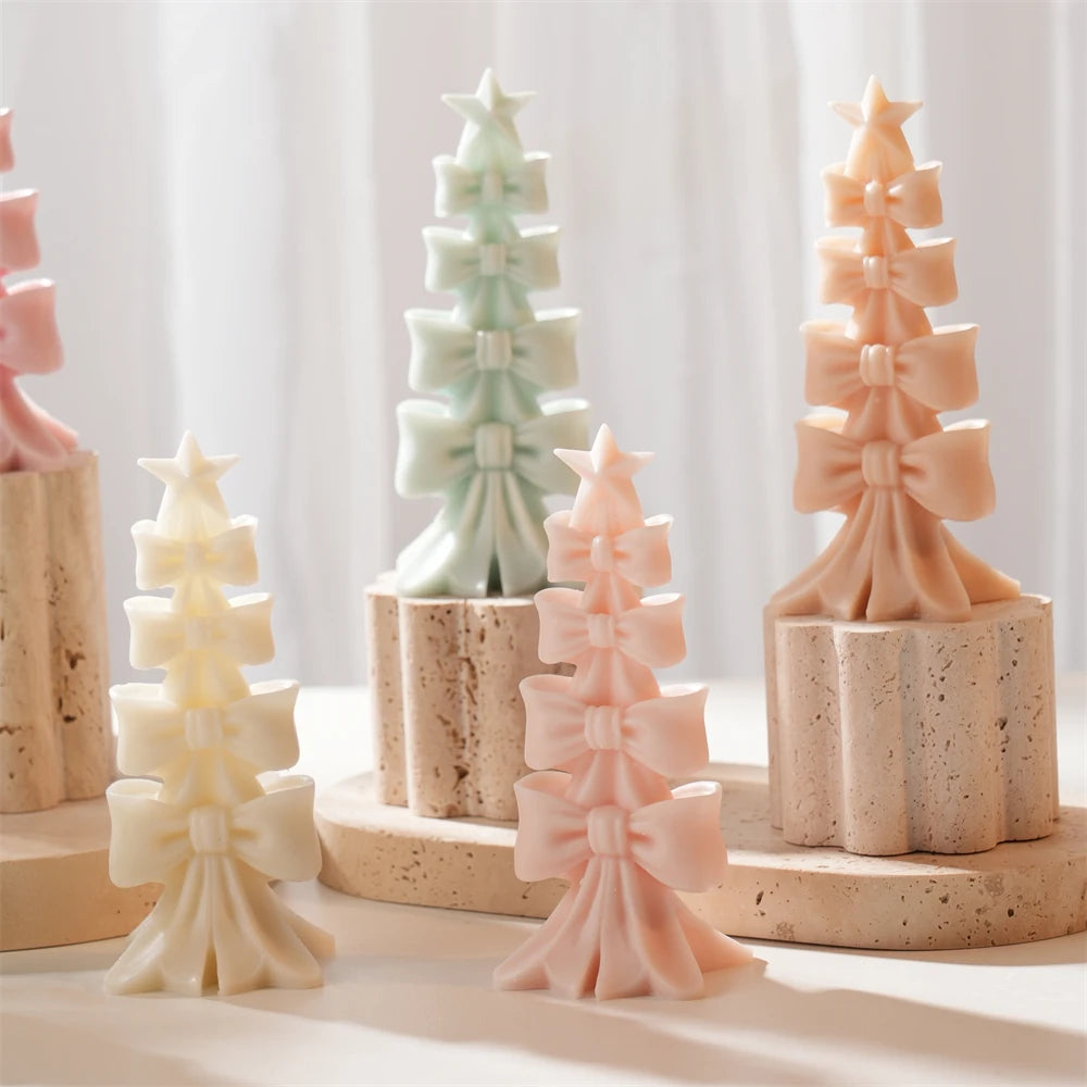 Pastel bow-stack trees with stars at their tops