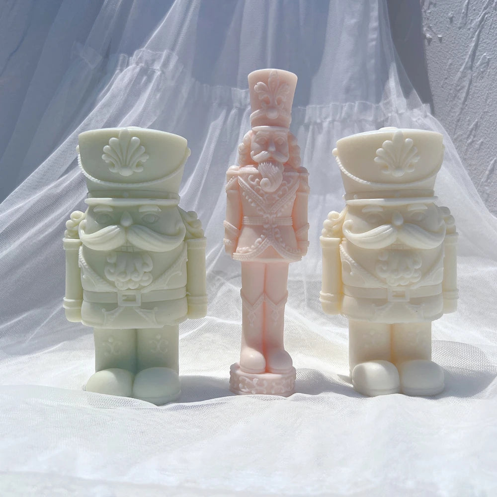 Tall standing nutcracker sample beside separate shorter nutcracker designs