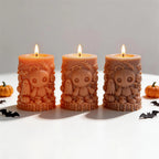 Lit Halloween pillars with stitched doll and ghost relief