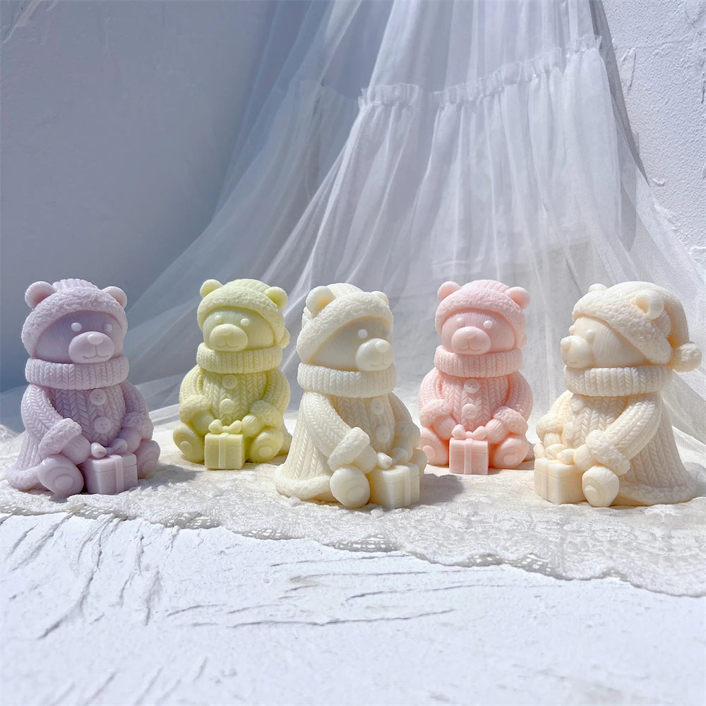 Seated winter bear castings holding gift boxes