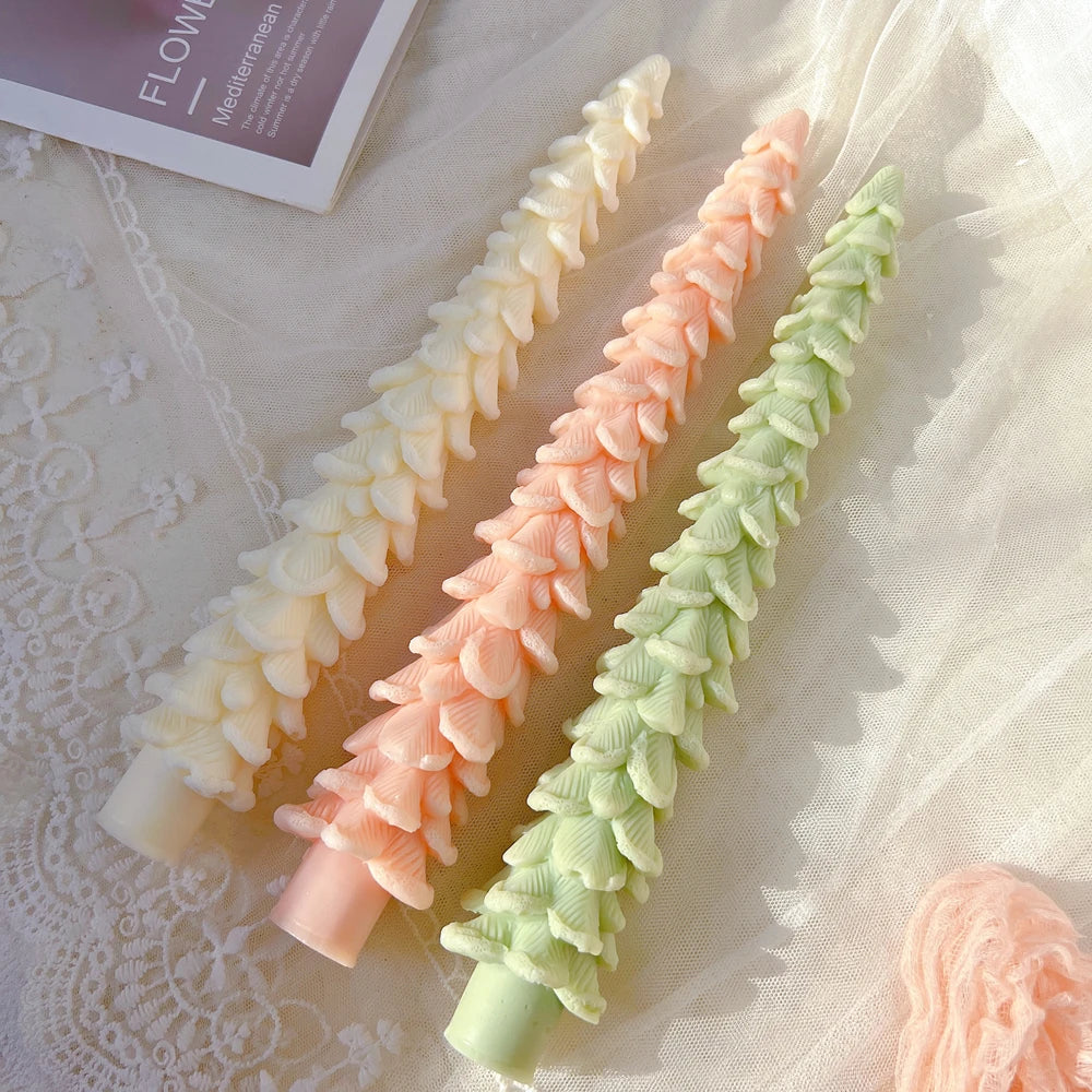 Three slender Christmas tree taper candle examples