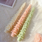 Three slender Christmas tree taper candle examples
